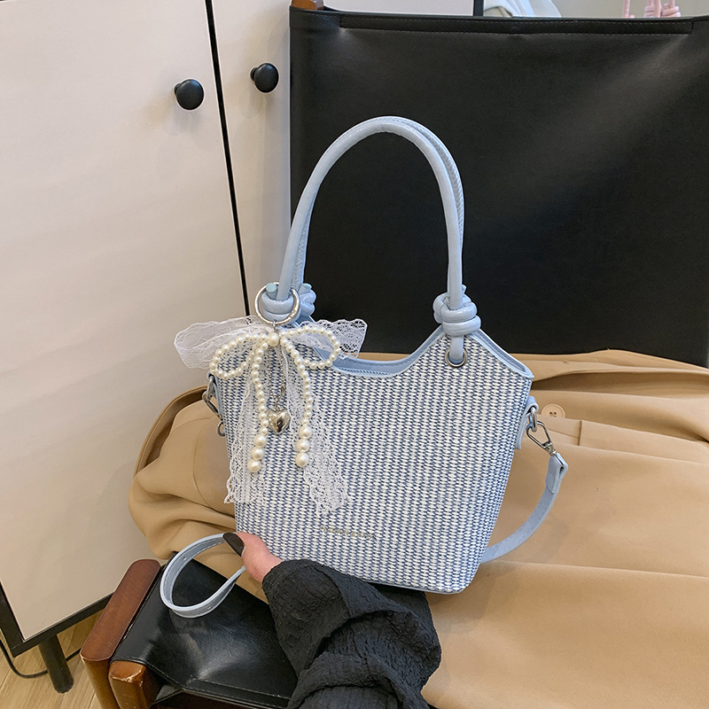 Bolsos de alta gama para mujer 2025 nuevo bolso de cubo popular moda bolso de hombro de todo fósforo bolso de mensajero de cercanías