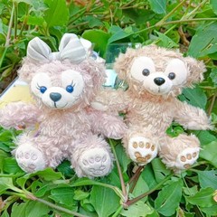 漫画の裸の座っている姿の達菲熊雪莉のぬいぐるみのかわいいカバンのキーホルダーのペンダントの人形は掛けます。