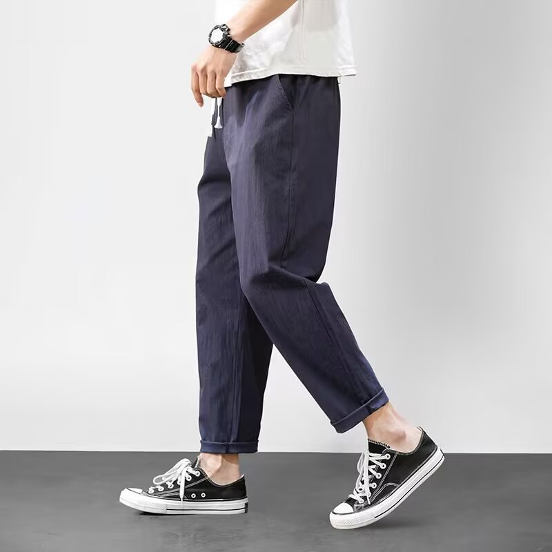 Pantalones casuales para niños otoño nueva marca de moda ropa de trabajo recta suelta nueve puntos pantalones largos deportivos 2025 primavera y otoño ropa de hombre