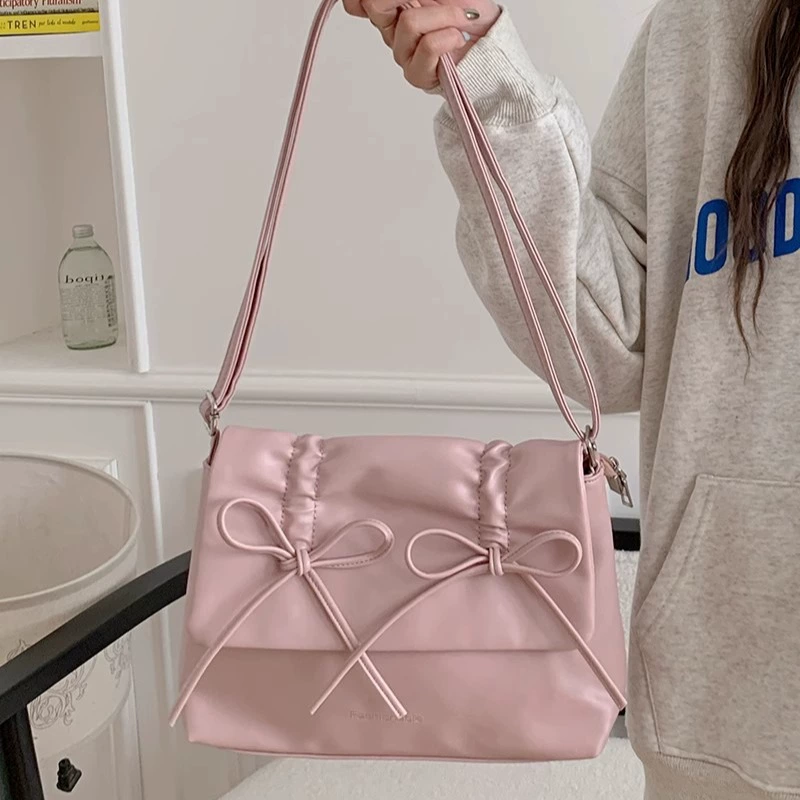 Cute fuchsia shoulder bag with bow, capacious one-shoulder bag