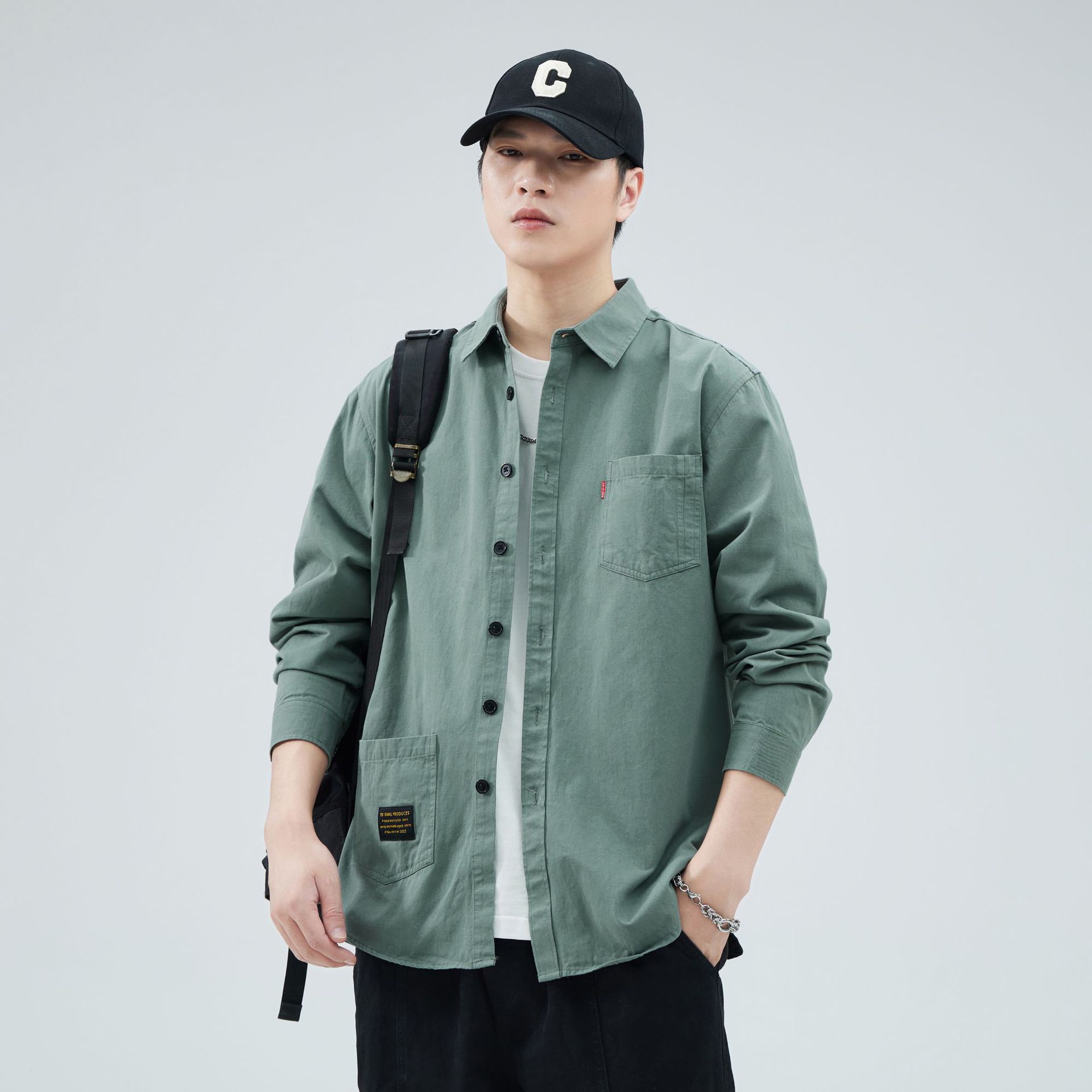 Camisas personalizadas de fábrica para hombres primavera y verano algodón de manga larga tendencia de ropa de estilo americano con solapa de bolsas de moda de ropa de estilo