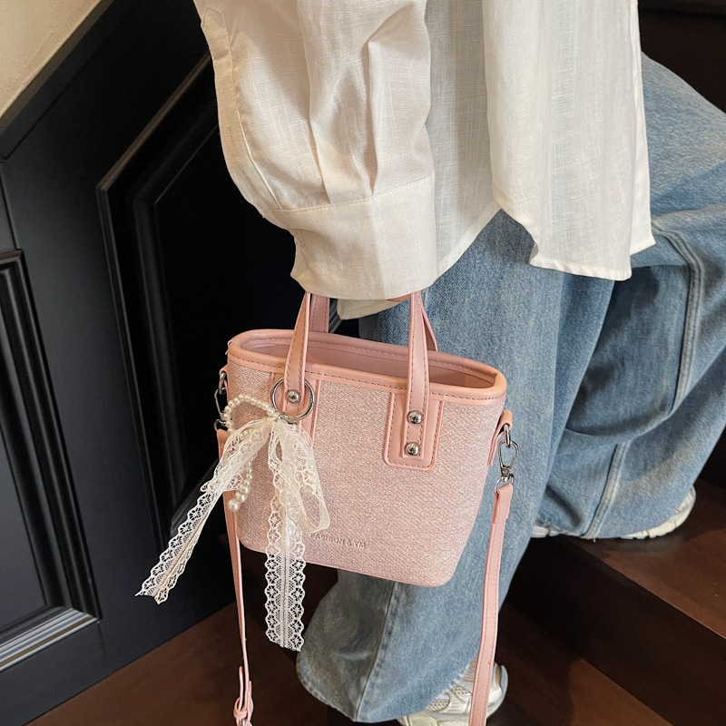 Bolso de cubo de mano de estilo occidental de moda para mujer 2025 nuevo bolso de hombro de todo fósforo de color de contraste bolso de mensajero de viaje de textura de moda