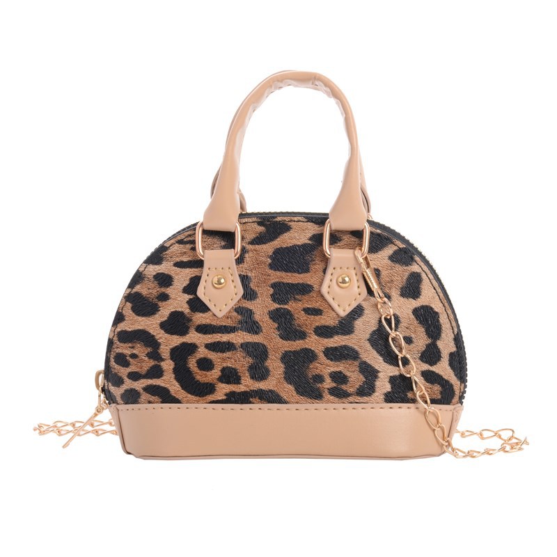Moda cool leopardo mochila para hombres y mujeres, bolso de hombro compacto mini bebé bolso de cadena 2025 nuevo bolso de conchas para niños