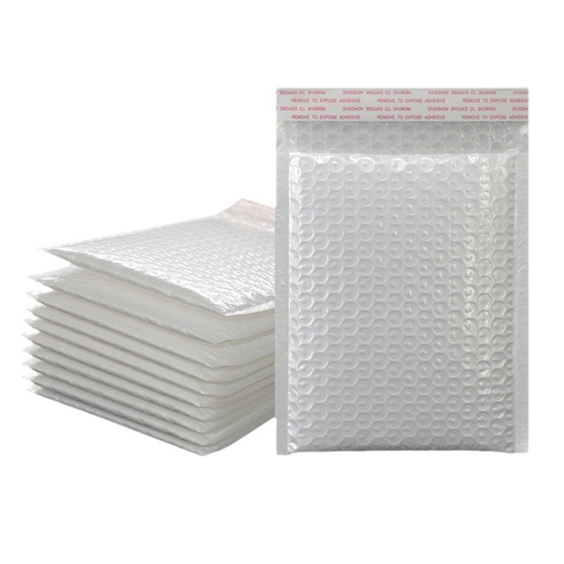 Bolsa de burbujas de película nacarada compuesta blanca a prueba de golpes bolsa de envoltura autoadhesiva bolsa de embalaje de bolsa de espuma engrosada en stock