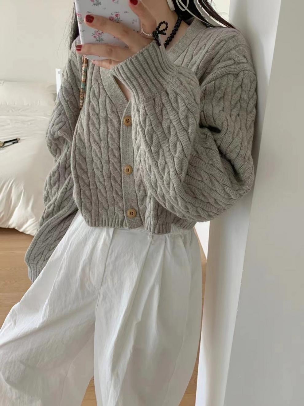 Corea del Sur Dongdaemun simple torcido corto de cintura alta jersey cardigan de punto para mujeres otoño y invierno nuevo suéter de manga de linterna pequeña