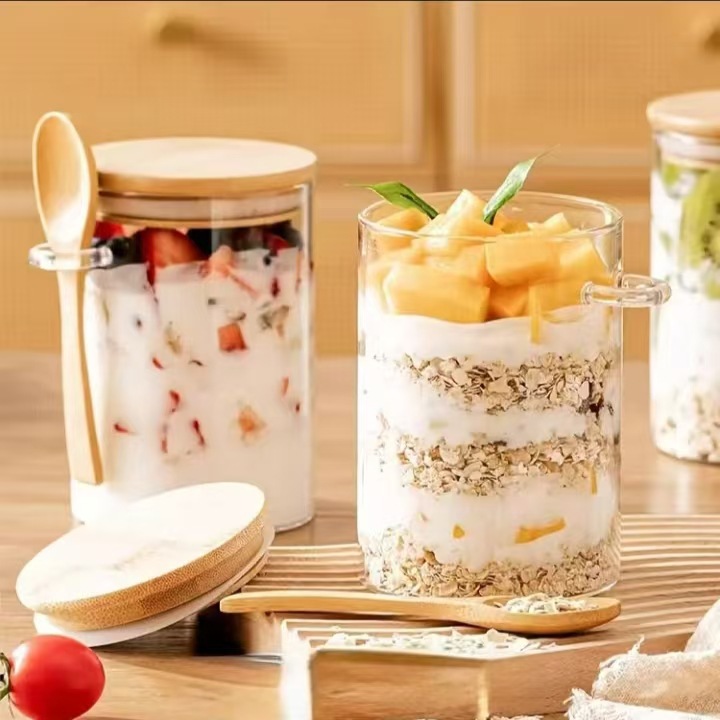 Transfronterizo transparente redonda cubierta de bambú lata de vidrio con cucharas de bambú almacenamiento de cocina barro de queso de trigo barro a prueba de humedad lata de sellado de cilindro recto