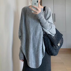 秋の新型の怠惰な風の不規則な純色の斜め肩のセーターの女性のゆったりとした肩の長袖のニットの上着の女性