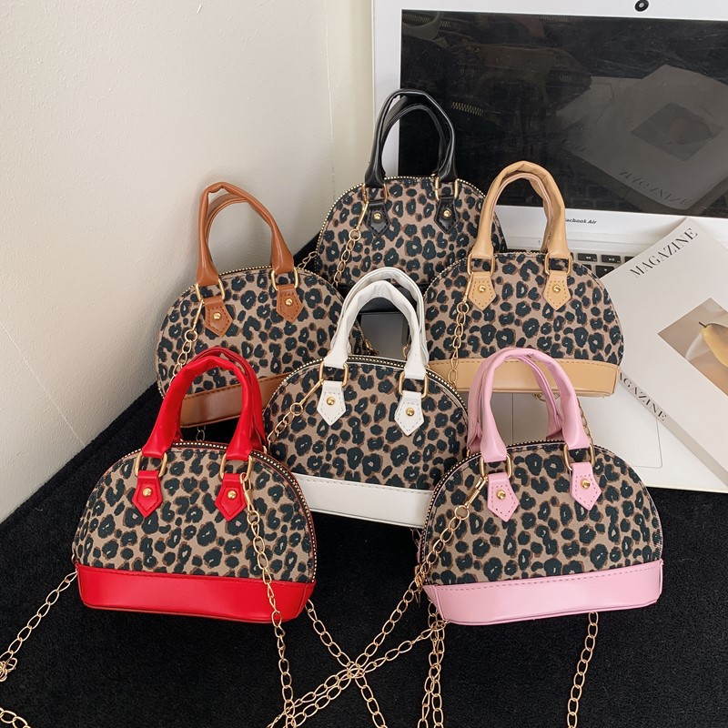 Exquisita y compacta bolsa de niña estampado leopardo extranjero mini bolso de cadena bebé nuevo estilo coreano bolso de conchas para niños