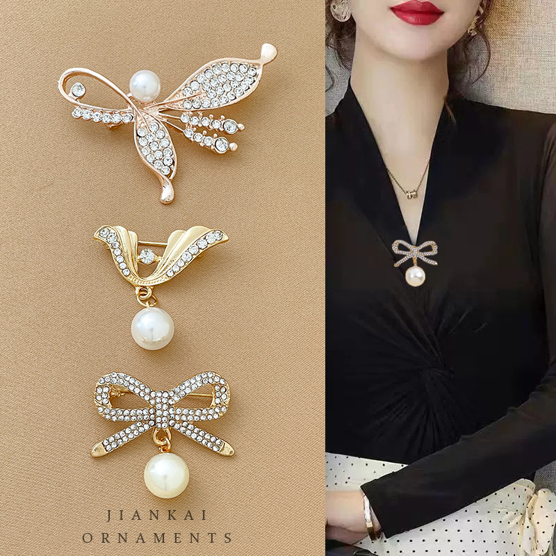 Arco de mariposa artefacto de alta gama sin costura broche pequeño temperamento femenino universal pin de ropa fija de traje collar