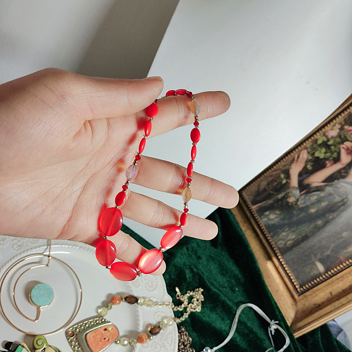 Collana con ciondolo a forma di bambola in pietra di cristallo con fiore e nappa di perle vintage, articolo unico per donna_voghion.com
