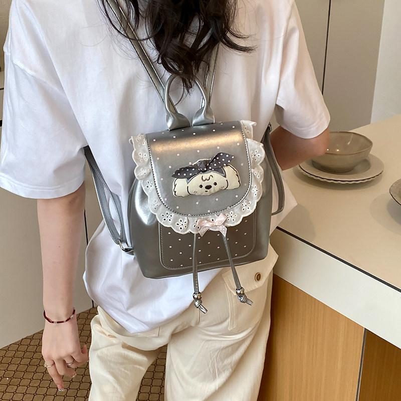 Mochila casual mochila de verano dibujos animados 2026 encaje versátil mochila escolar de mujer de viaje nuevo lindo punto de onda popular