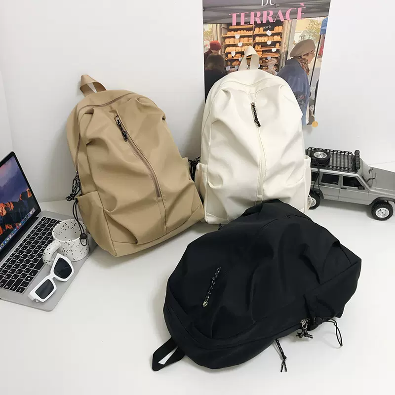 新款韩版简约情侣书包男女初高中生大学生旅行背包大容量双肩包女