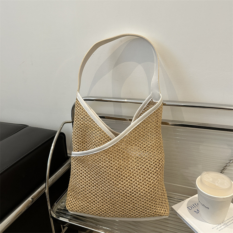 Popular bolsa de tejido de gran capacidad para mujeres 2024 verano nueva bolsa de hombro universal bolsa de viaje de moda