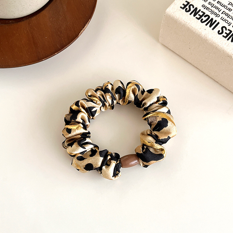 Temperamento europeo y americano estampado leopardo anillo de cabello simple de alta elástica cuerda de cabello gruesa cuerda de cabello de bolas duradera correa