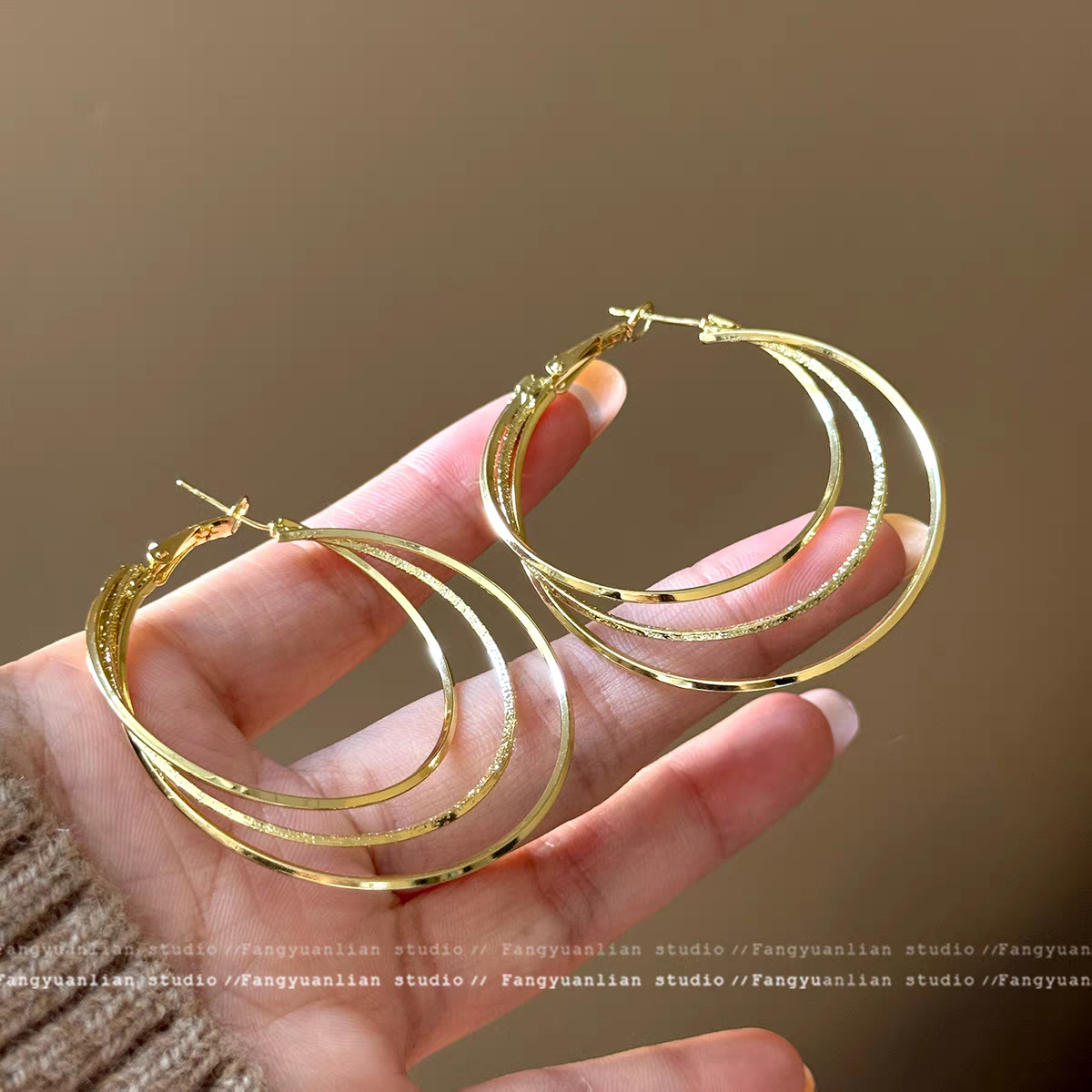 Golden large earrings