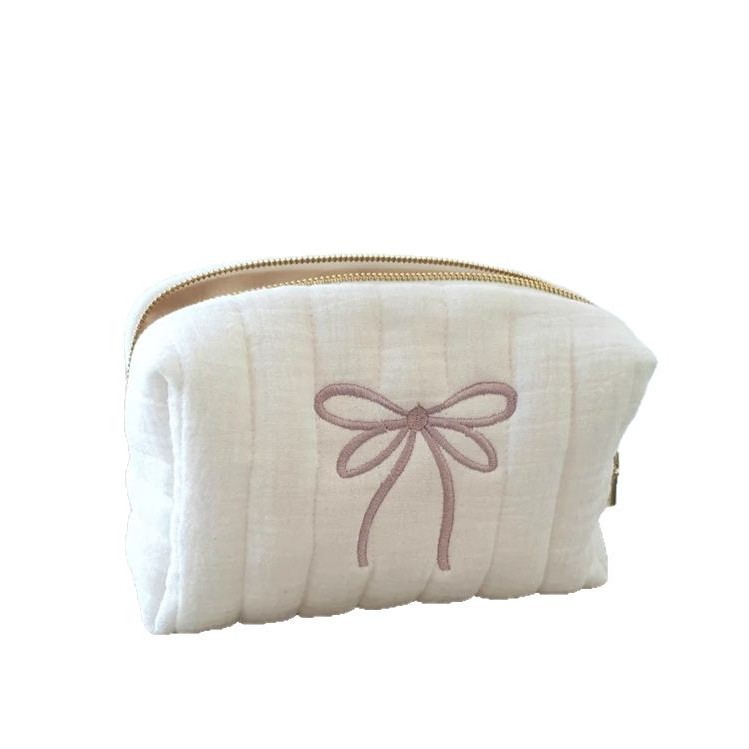 Fashionable cosmetic bag with bow