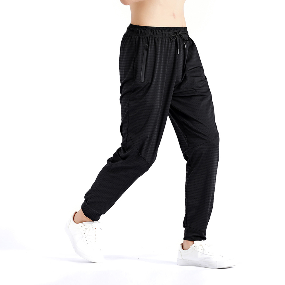 Pantalones deportivos de otoño sueltos más el tamaño de los hombres pantalones elásticos de entrenamiento de secado rápido pantalones ajustados de seda de hielo transpirable en stock
