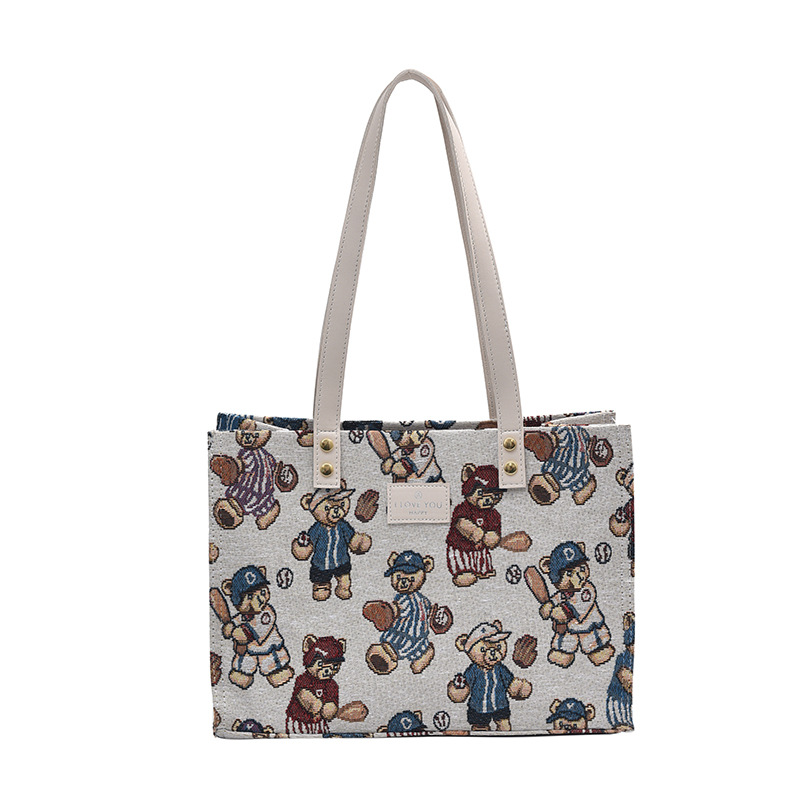 Bolsa de lona impresa de dibujos animados para mujeres 2024 nueva bolsa de gran capacidad, bolsa de hombro de viaje casual versátil