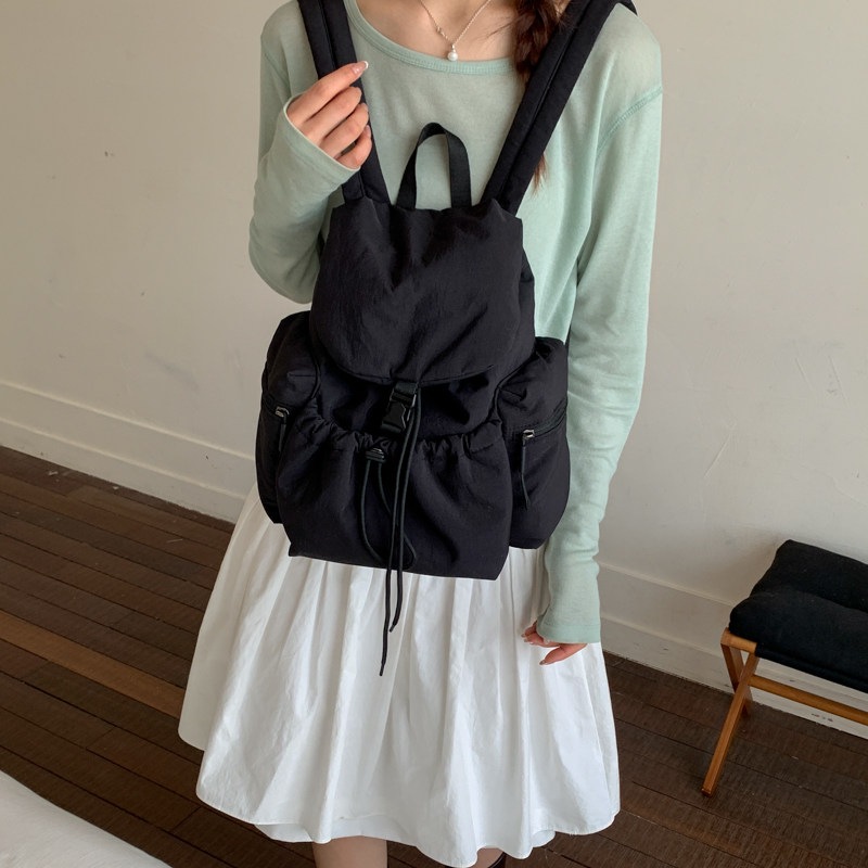 2026 más ocio simple de gran capacidad mochila de cuerda de extracción para estudiantes nueva mochila de bolsillo de mujer coreana de verano ligera