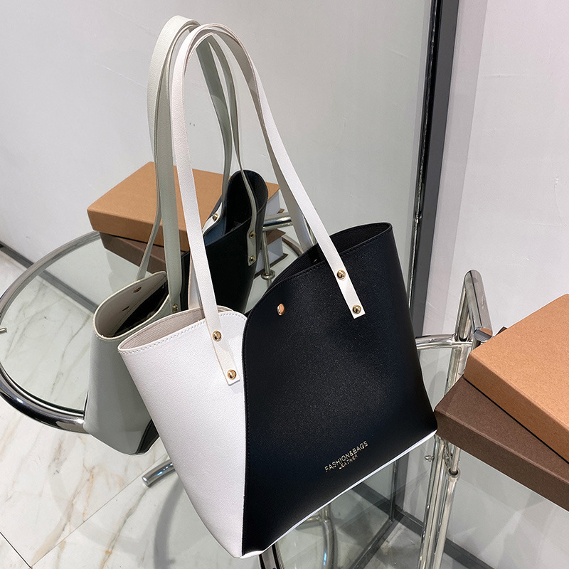 Bolsas de mujer al por mayor de comercio exterior 2023 nueva moda bolsas de hombro de moda personalidad bolsas de tote de color una bolsa transfronteriza