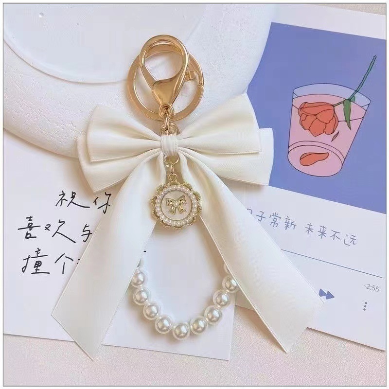 New creative bow pearl key chain women fashion bag pendant car key chain personality pendant