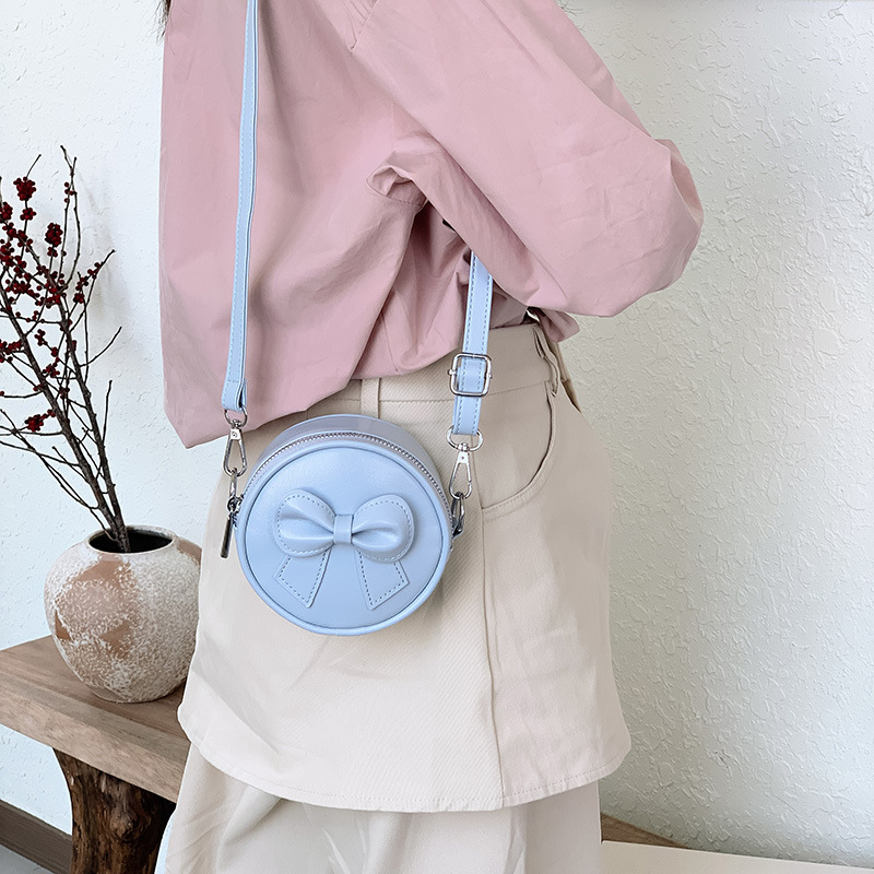 Hermosa bolsa de hombro para chicas de arco, mini bolsa de bebé simple de color sólido, bolsa de cambio para niños de moda
