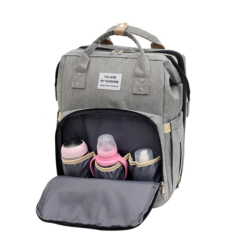 Mochila maternal multifuncional plegable con cuna y puerto USB, bolso de viaje de gran capacidad