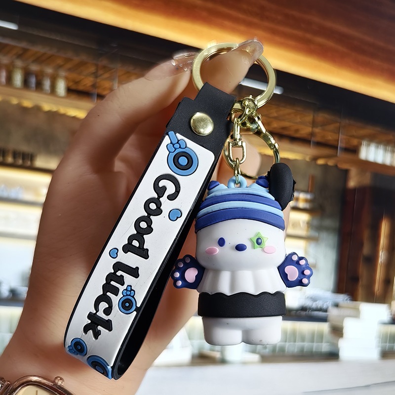 Perro de orejas grandes Melody KT gato pudín perro Kolomi caricatura de silicona llavero colgante bolsa colgante caja ciega regalo