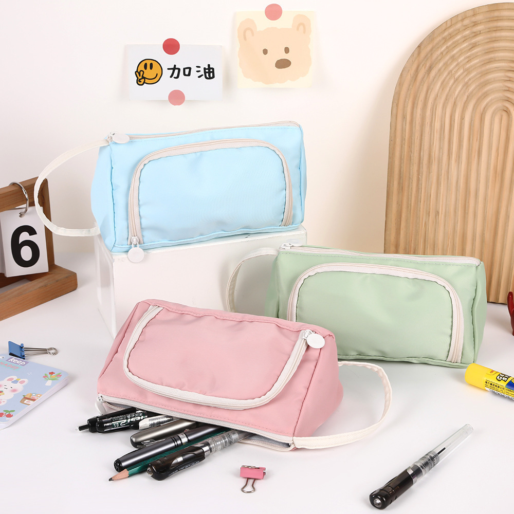 Bolso para lápices con ventana triangular transfronteriza Versión coreana de la caja de papelería de color sólido simple Bolsa de papelería de gran capacidad multifuncional creativa