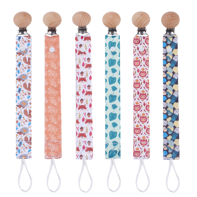 Nuevos productos para bebés creativos de cabeza redonda abrazadera de chupeta de beech desmontable larga cadena de chupeta de tela