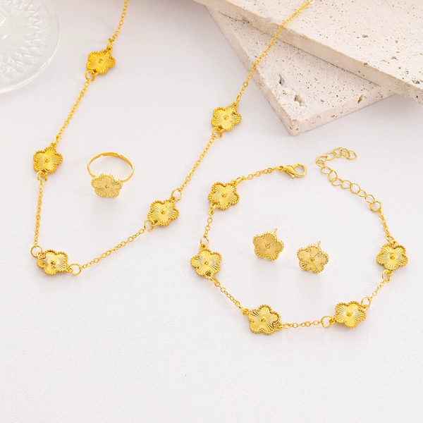 Golden necklace, bracelet, earrings, ring