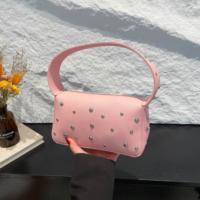 Bolso de axila con textura transfronteriza 2025 verano nuevo bolso femenino bolso de remache personalizado bolso de hombro con patrón de lichi de moda