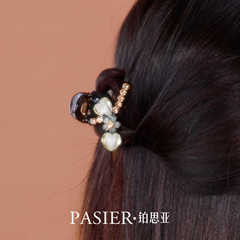 高級感のあるヒナギクのヘアピンの女性の春の限定の新型の花のヘアピンの甘い気質の風の半髪の髪飾り