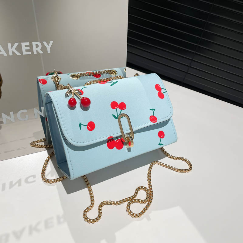 Popularidad transfronteriza pequeña fresca impresión de cereza bolso cuadrado para mujeres 2025 verano nuevo bolso de hombro universal mochila