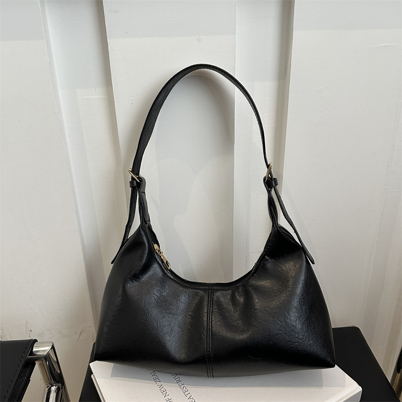 Nuevo diseño de nicho bolso de axila de piel de vaca otoño e invierno bolso de mensajero casual de un solo hombro bolso de baguette de moda para mujer