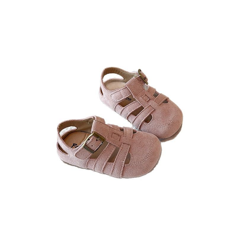 Sandalias romanas huecas para niños 2025 verano nuevo estilo coreano niña plataforma botas de fondo grueso zapatos de playa Baotou para niños