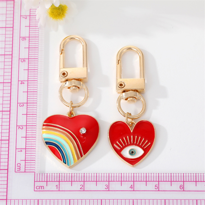 Cute Rainbow Heart Shape Eye Alloy Enamel Inlay Rhinestones Women's Keychain 1 Piece display picture 1