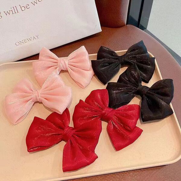 Cute children's fuchsia red universal hairgrip with bow