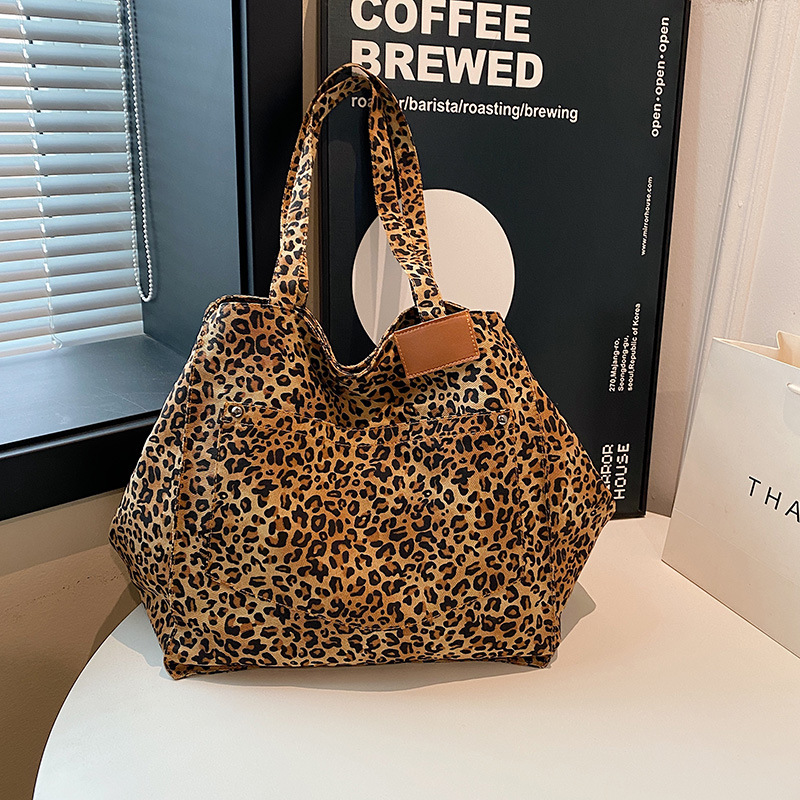 Bolso de mano de lona con estampado de leopardo de nicho Bolso de mujer Bolso de mano de moda de gran capacidad casual Bolso bandolera de estilo occidental coreano
