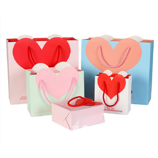 Factory in stock wholesale love gift bag wedding gift bag portable packaging paper bag heart-shaped printed logo