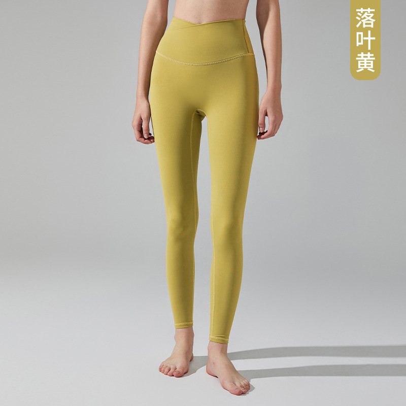 桃色のハイウエストでヒップアップ効果のある、ラインが目立たない高強度ヨガパンツ。ランニング、春夏秋に最適なタイトフィットのスポーツウェア、女性用。|undefined