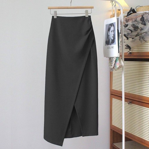 A mid-length dress with a high waist, featuring an irregular hemline, side slits, and a fitted silhouette, combining the style of a tailored blazer with the flair of a autumnal pleated skirt.