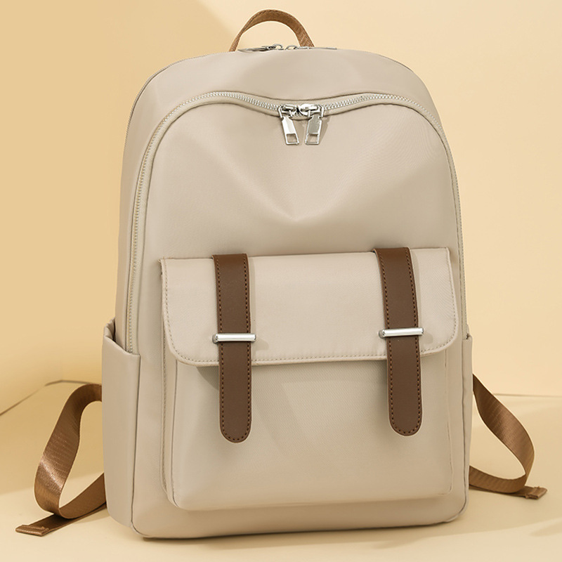 Comercio exterior al por mayor 2025 nueva mochila de nailon para mujer de color de contraste, mochila de computadora de gran capacidad anti-salpicaduras