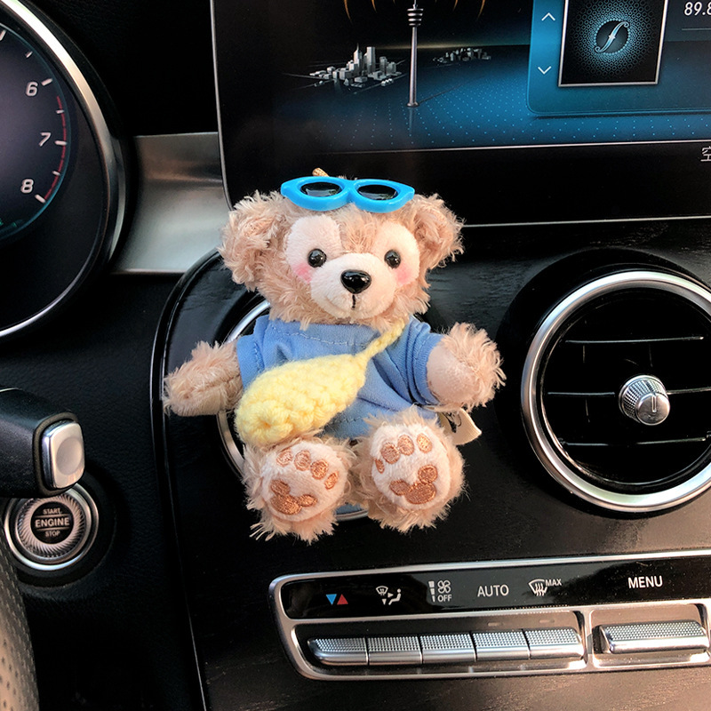 2025 nuevo coche muñeca oso de felpa Tamiflu coche aromaterapia de salida de aire decoración interior accesorios de coche decoración mujer