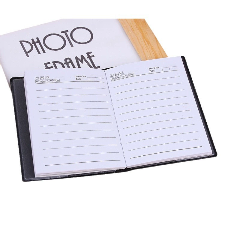 Small pocket telephone, handheld laptop, book, notebook
