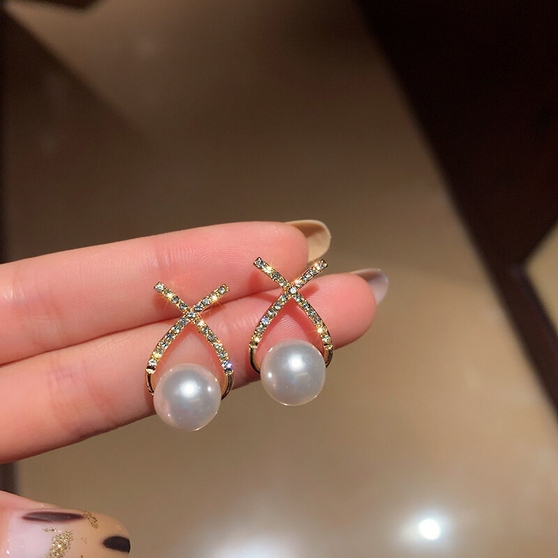 34 # pendientes de perlas cruzadas