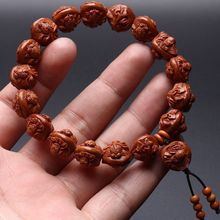 天然明星热卖龙纹桃核雕刻手串富贵有鱼文玩饰品男女情侣款通用礼