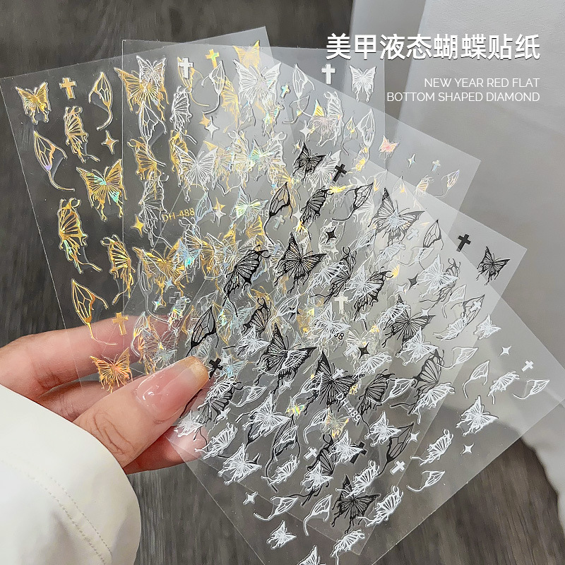 液体の蝶のネイルシールの立体レーザーと金銀の白黒の蝶の薄い靭性帯のゴムを背負って花の爪を貼って卸売りを貼ります。|undefined