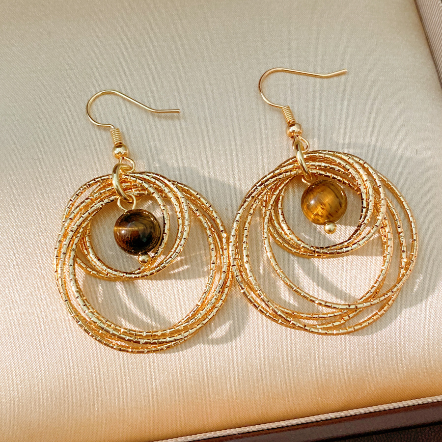 Medieval vintage ojo de tigre redondo hueco gancho de orejas temperamento temperamento temperamento aretes ligeros lujosos de alto nivel sensación de orejas