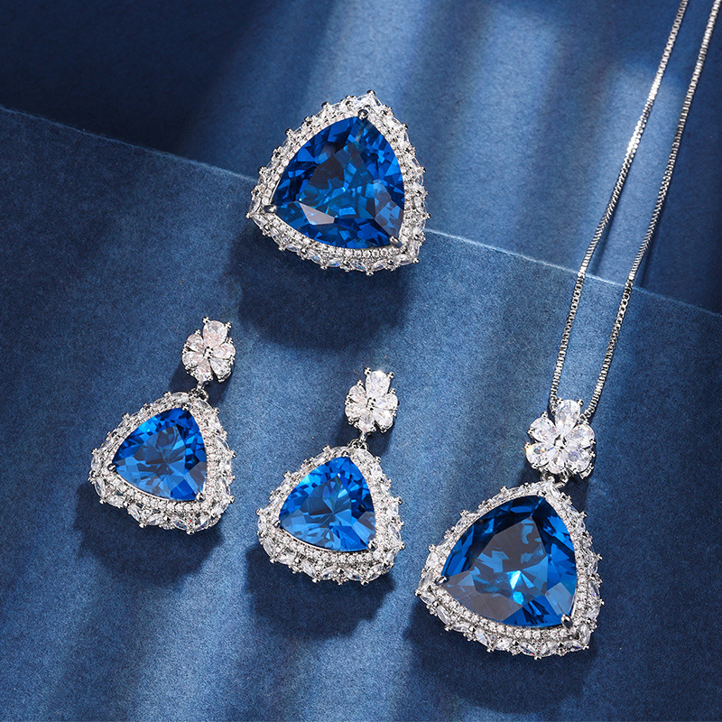 El otoño y el invierno Nueva Zhuang Sheng joyas de cobre de fondo chapado en oro de simulación azul de cristal puntiagudo traje avanzado 17*17-12*12